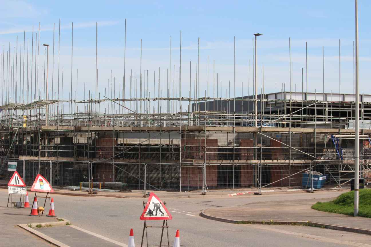 Depicting the Town Centre under construction in Cranbrook with scaffolding everywhere